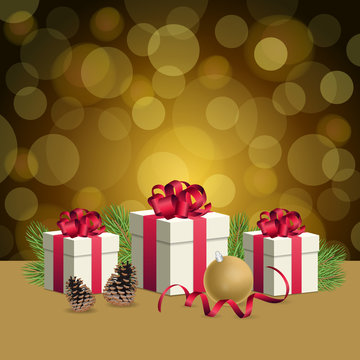 Golden bokeh background and christmas gift boxes with decoration balls