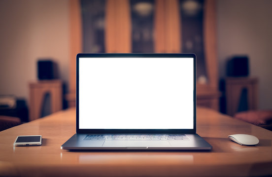 Laptop with blank screen on table. mockup