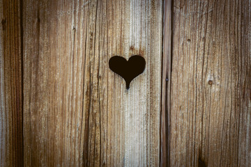 The wooden door with heart. Background