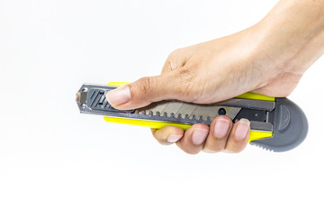 hand holding cutter, sharped knife