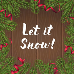 Modern lettering Let it Snow on wooden background with fir branches
