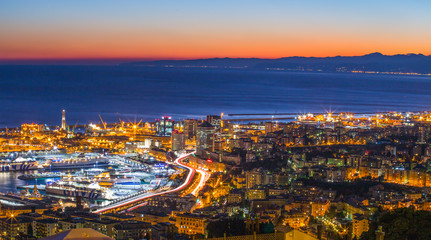 Fototapeta na wymiar GENOA, ITALY, OCTOBER 27, 2016 - Aerial view of Genoa, Italy, the harbor with the causeway by night / Genoa, October 27, 2016 Italy, Europe