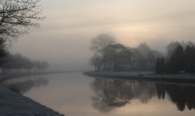 Dutch canal in morning fog. Rogat Drenthe Nethelands. Early morning.
