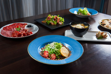 Restaurant table full of delicious food