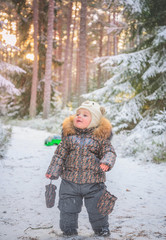 Child sleeding in winter snow fairy forest