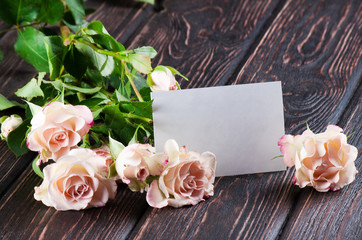 Fresh rose on wood desk