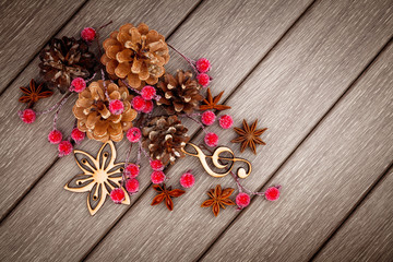 Christmas natural decoration, wooden toys, cones, berries and sp
