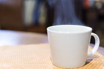 Coffee cup at wooden table
