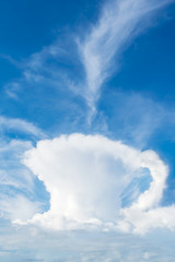 Cloud with coffee cup shape on blue sky background