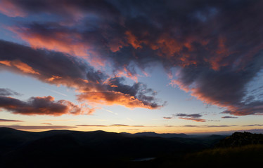 A dramatic sunset sky above Ullswater in the English Lake District