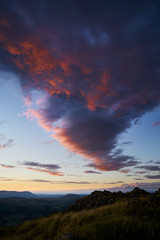 Naklejka na ściany i meble A dramatic sunset sky above Ullswater in the English Lake District