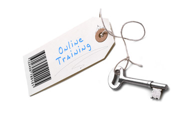 A silver key with a tag attached with a Online Training concept