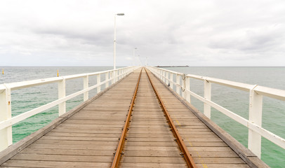 Historic Busselton Jetty in Western Australia, longest timber pier in the Southern Hemisphere, with railway line.