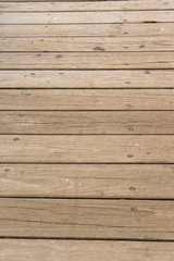 Wooden planks that make up a large pier.