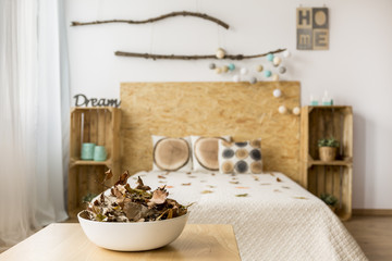 Bowl of leaves in bedroom