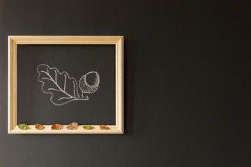 Chalkboard wall with acorn drawing