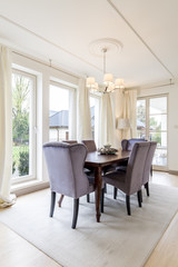 Room with wooden table and chairs