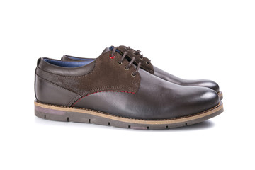 male shoes in brown leather on white background, isolated product, top view
