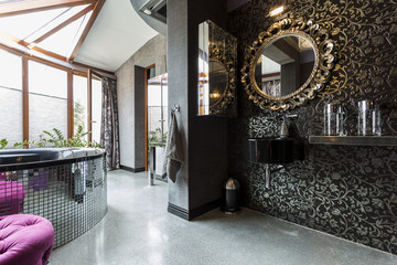 Futuristic dark bathroom with bathtub