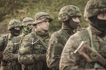 Male soldiers in battle uniforms