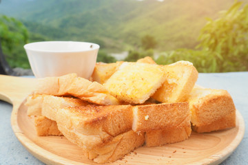 Bread and mill on nature background