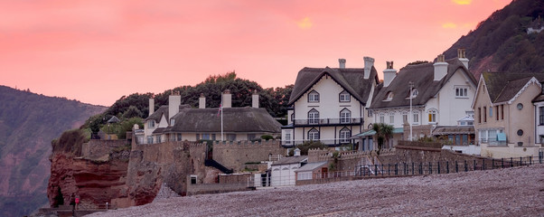 Houses with traditional thatched roofs. English Channel Coast. Sidmouth. Devon. England
