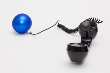 Old phone reciever and cord connection with Christmas decoration
