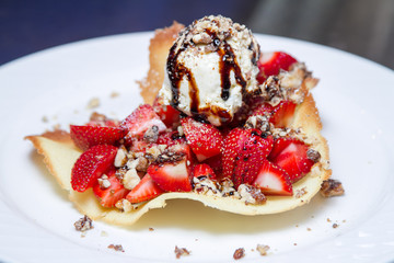 Ice-cream balls with fruit in cafe