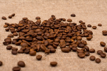 Coffee beans on sackcloth fabric