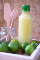 Fresh lime and lemon lemonade in plastic bottle