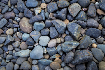 Natural blue stone on the beach background, outdoor day light
