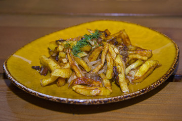 Potatoes fried with pig fat and mushrooms.