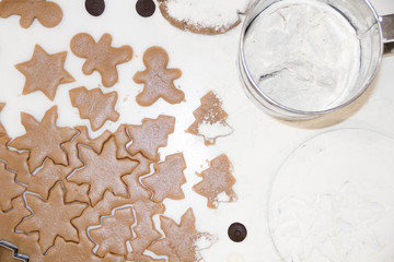 Christmas cookies. Baking . Roll out the dough to cut stars on a wooden background