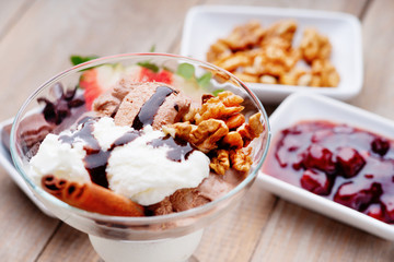 Ice cream sundae, walnuts and jam 