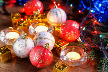 Christmas balls, gift boxes and candles 