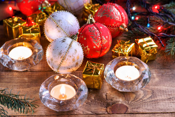 Christmas balls, gift boxes and candles 