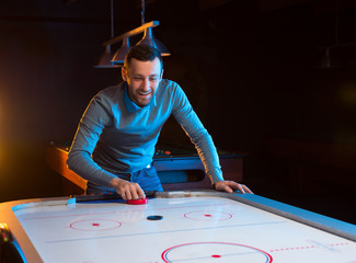 Air hockey game is fun even for adults