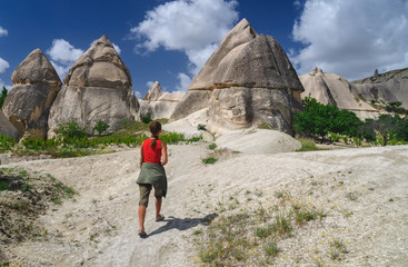 Yung girl walking in Love Valley of Cappadocia.
