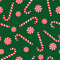 Candy cane and lollipop seamless christmas pattern on green background. Happy New Year and Merry Xmas background. Vector winter holidays print for textile, wallpaper, fabric, wallpaper.