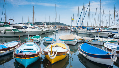 Small boats and yachts docked in the marina of villefranche sur mer near the city of Nice in the south of France 