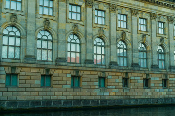 bode museum with stone facade and spree river on the ground