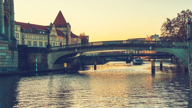 Spree river in the afternoon with a bridge in the middle and the bode museum on the left side