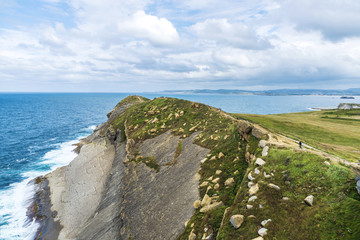 Rocky coastline along cliffs in Santander, Spain