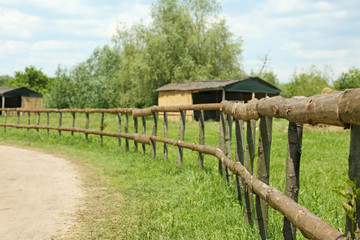 Fototapeta na wymiar Old wooden fence in the village