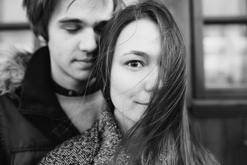 Beautiful young adult couple posing at camera