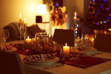 Close up view of table served for Christmas dinner, on blurred background