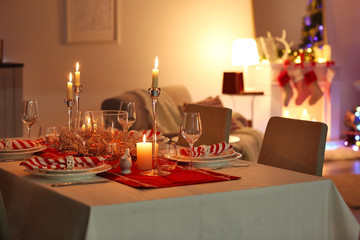 Table served for Christmas dinner in living room, close up view