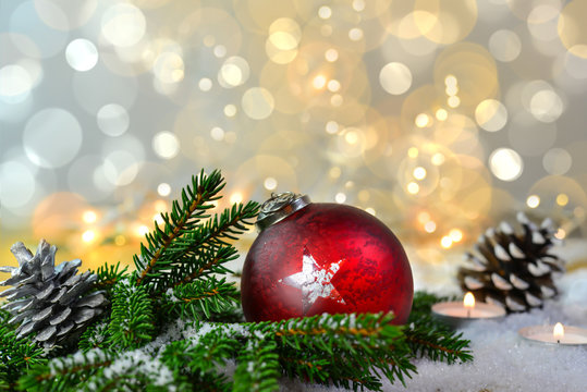Red christmas ball and background in silver/gold