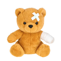 Teddy bear with bandage isolated on white