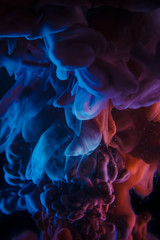 The colorful dye in the water. Abstract background. Wallpaper. Concept art
